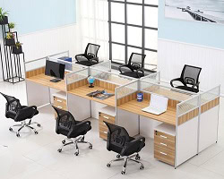 Modern office desks with Herman Miller A02 Friant Cherrywood surfaces and ergonomic chairs.
