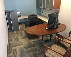 Eames Collection office with Herman Miller furniture, including a desk, chair, and storage units.