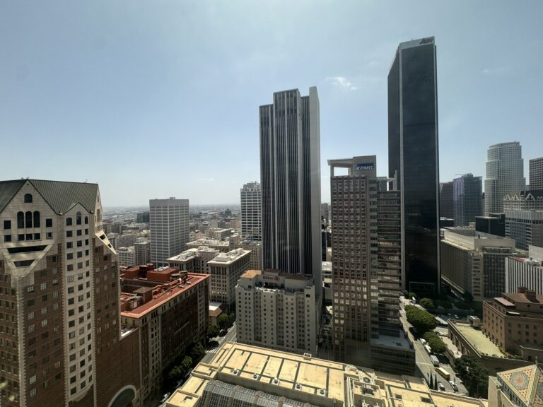 a city skyline with tall buildings