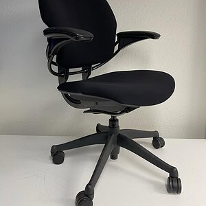 Black Humanscale Freedom task chair for ergonomic office comfort.