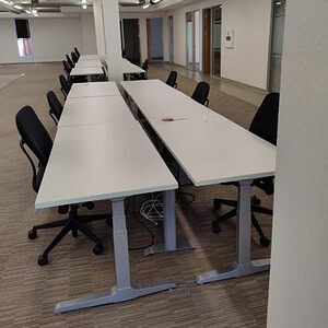 Stand desks featuring sleek silver bases, ideal for modern office environments and ergonomic workspa.