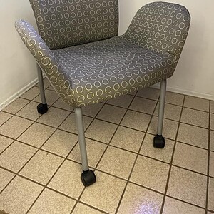 Haworth Look chair in neutral sage fabric with casters, ideal for modern office or conference room s.