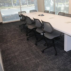 Modern 10' White Steelcase powered conference table in a professional office setting.