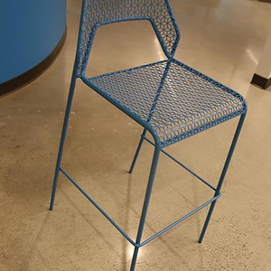 Blue mesh metal stacking stool for modern outdoor or indoor seating.