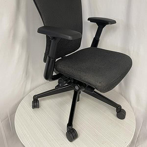 Haworth Zody ergonomic office chair with black and charcoal cover, adjustable armrests, and lumbar s.