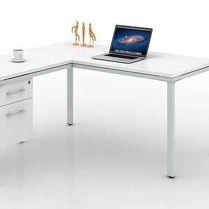 Desk with storage drawers and laptop on white surface.