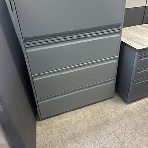 Gunmetal finish 4-drawer lateral file cabinet for office storage.