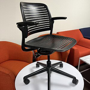 Ergonomic black office chair with adjustable height and lumbar support, ideal for workspace comfort.