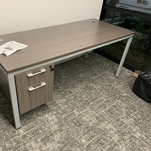 Modern Driftwood 6'x30" Boss Desk with suspended pedestal for office use.