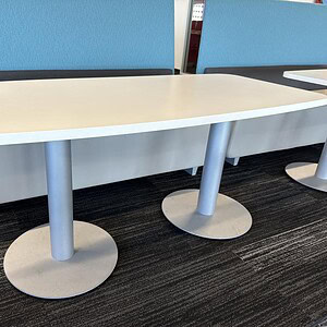 Modern Allsteel 60'x30" boat-shaped conference table for office meetings.