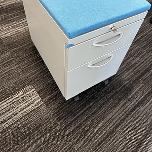 Maxon Blue Mobile Pedestal with Cushion for office storage and comfort.