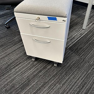 Maxon White mobile pedestal with grey cushioned top for office storage and comfort.