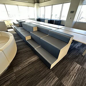 Modern Gunlocke leather modular seating in a bright office space.