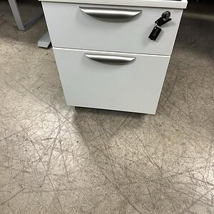 White and grey cushion mobile pedestals for office storage and organization.