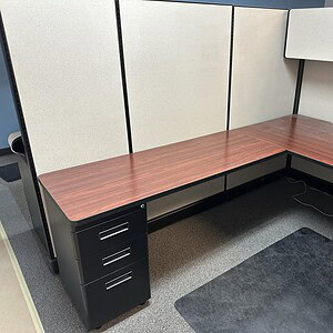 Herman Miller A02 67-inch beige and cherry office desk with black metal drawers.