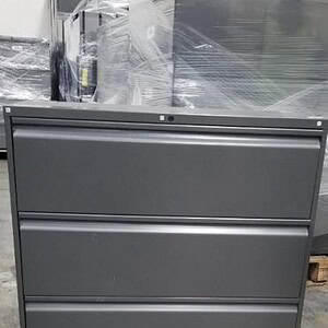 Gunmetal gray 3-drawer lateral file cabinet for office storage.