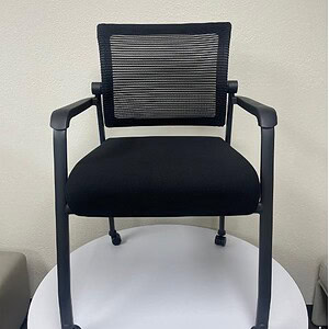 Guest office chair with mesh back and casters for mobility.