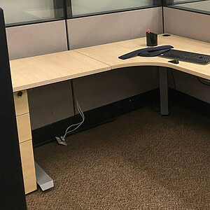 Shaped desk base for ergonomic workspace setup. Perfect for modern office environments and customiza.
