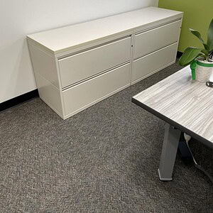 White Meridian 6-foot credenza with two lateral file drawers, perfect for office storage and organiz.
