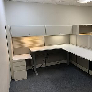 Electric desk in grey with adjustable height, ideal for modern office setups.