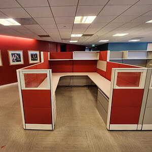 Modern red glass cubicle workstation for office spaces.