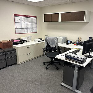 L Shape 6'x6' White Height Adjustable Desk in Office.