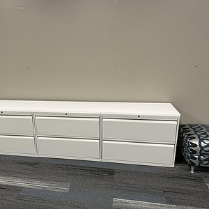 Lateral file cabinet with silver drawers and white top, ideal for office storage and organization.