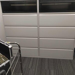 Lateral file cabinet with five drawers in Knoll White, ideal for office storage and organization.