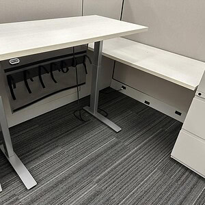 Height adjustable desk by Linak for ergonomic workspace comfort.