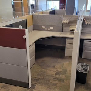 Modern Herman Miller Ethospace cubicle with glass panels and fabric partitions.