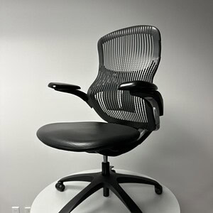 Modern Knoll ReGeneration office chair in black and chrome finish.