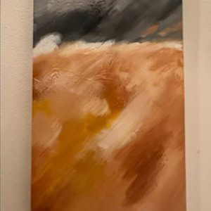 Orange and grey stone vertical wall art piece for interior decor.