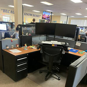 Modern office desk with dual monitors and ergonomic chair at Cube World USA.