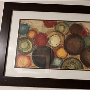 Vibrant abstract multi-circle artwork with bold colors and dynamic design, perfect for modern commer.