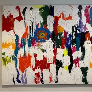 Vibrant abstract rainbow painting on a white canvas, showcasing bold brushstrokes and vivid colors.