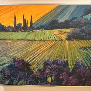Sunrise over rolling hills and vineyards on a canvas wall art piece.