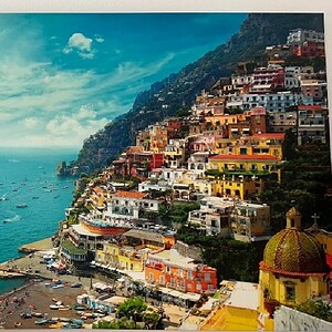 Vibrant 47"x32" Sea City canvas print showcasing colorful coastal buildings and ocean views.