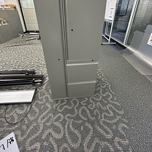 Herman Miller grey wardrobe file cabinet for office storage solutions.