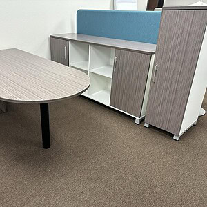 Driftwood finish bullet nose desk with matching storage and seating, ideal for office or workspace.
