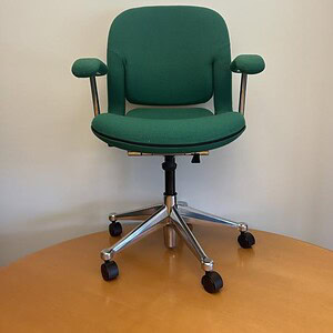 Green Herman Miller Equa 2 conference chair with adjustable armrests and ergonomic design.