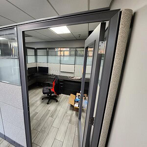 Ethospace office cubicle with glass door, 86-inch height, modern workspace solution.