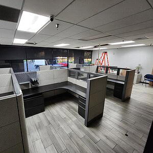Modern grey camo patterned office cubicles in a professional workspace.