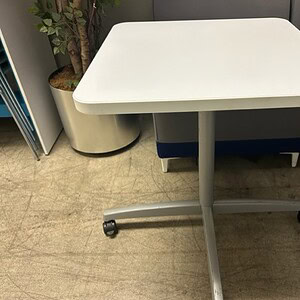 Square Steelcase white lunch table, ideal for office break rooms and cafeterias. Durable, modern des.