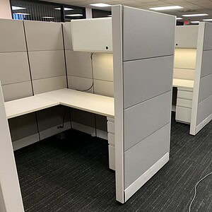Office cubicles with tall Ethospace panels, ideal for creating private work areas in modern offices.