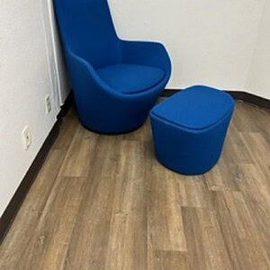 Blue Hightower Gimbal chair with matching ottoman for modern comfort.