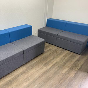 Modern Steelcase sectional sofa with blue and grey upholstery for office spaces.