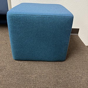 Blue square ottoman for modern interior decor.