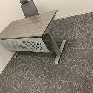 Driftwood finish height-adjustable desk with modern design and ergonomic features. Perfect for offic.