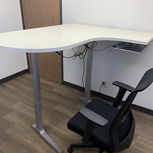 Adjustable desk for ergonomic workspaces.