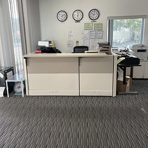 Ethospace office reception desk with modern design and ample workspace.
